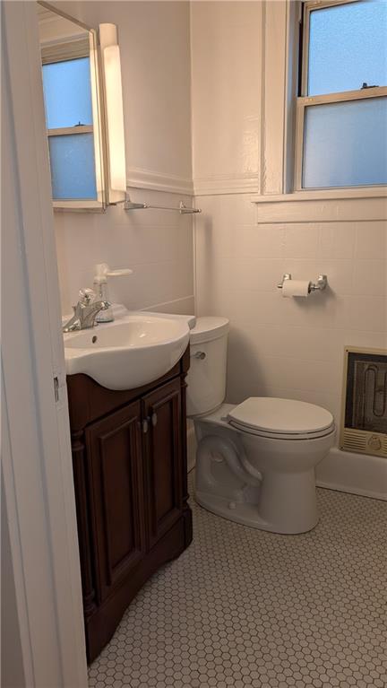 4068 Brandon Road Pittsburgh, PA 15212 - Photo 16 of 16 a bathroom with a sink a toilet and mirror