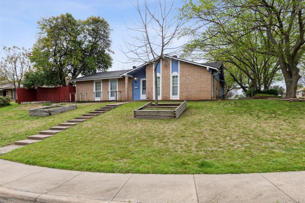 a backyard of a house with yard and outdoor seating