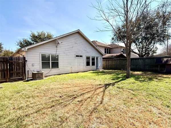 a house with trees in the background