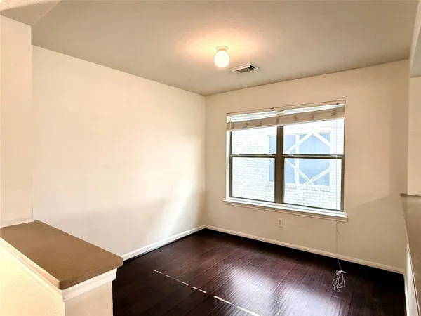 a view of an empty room and window