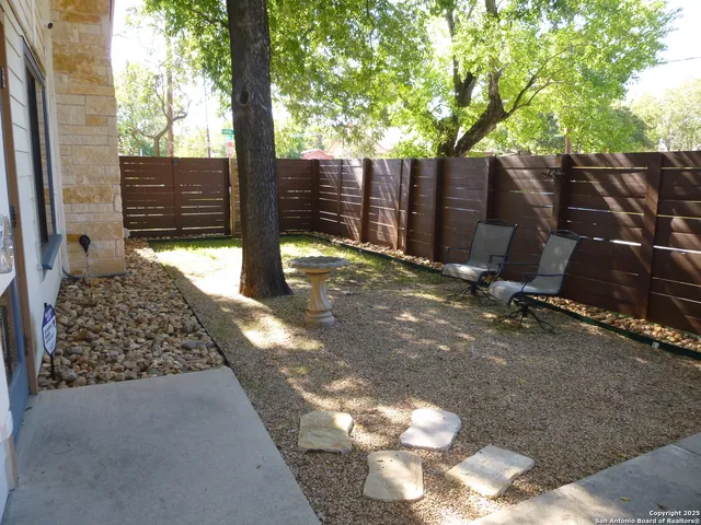 a view of a backyard of the house