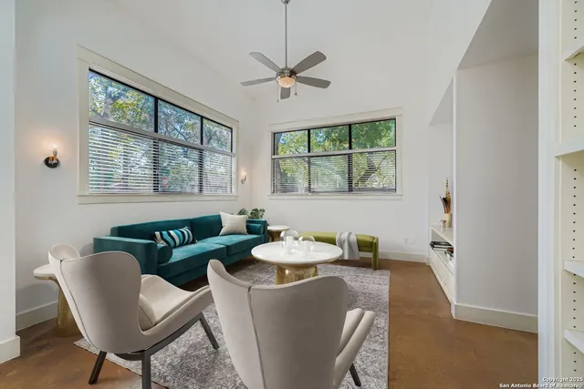 a dining room with furniture and windows
