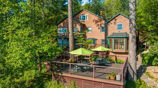 a front view of house with yard outdoor seating and green space