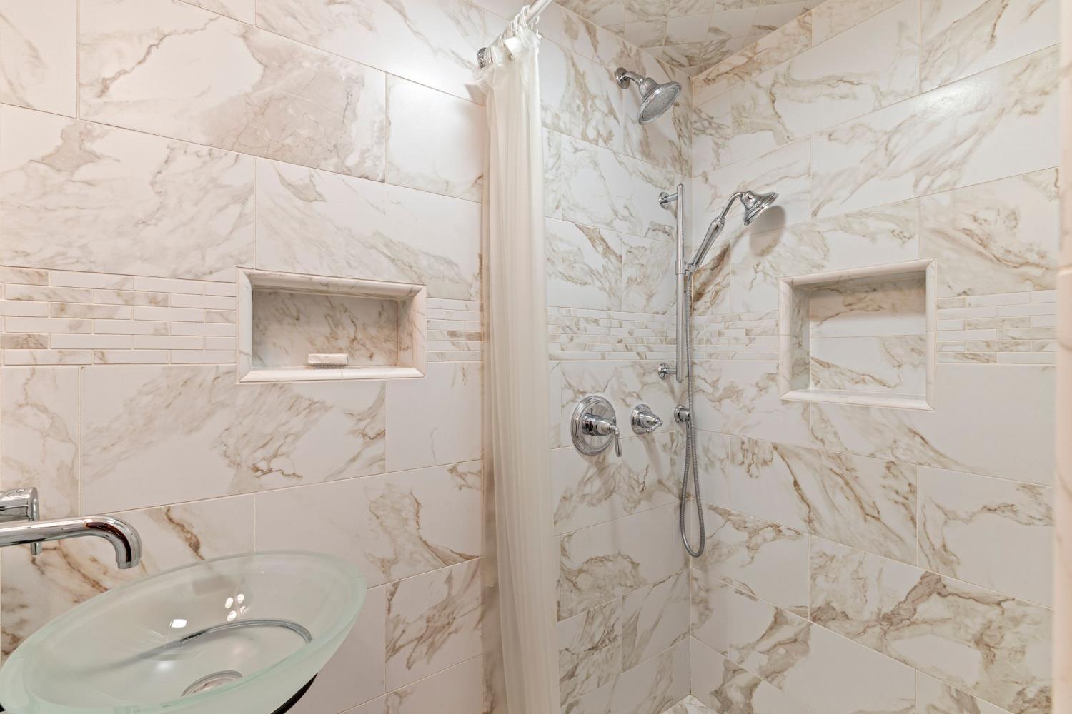 5821 Spanish Flat Road Placerville, CA 95667 - Photo 19 of 97 a bathroom with a toilet sink and shower curtain