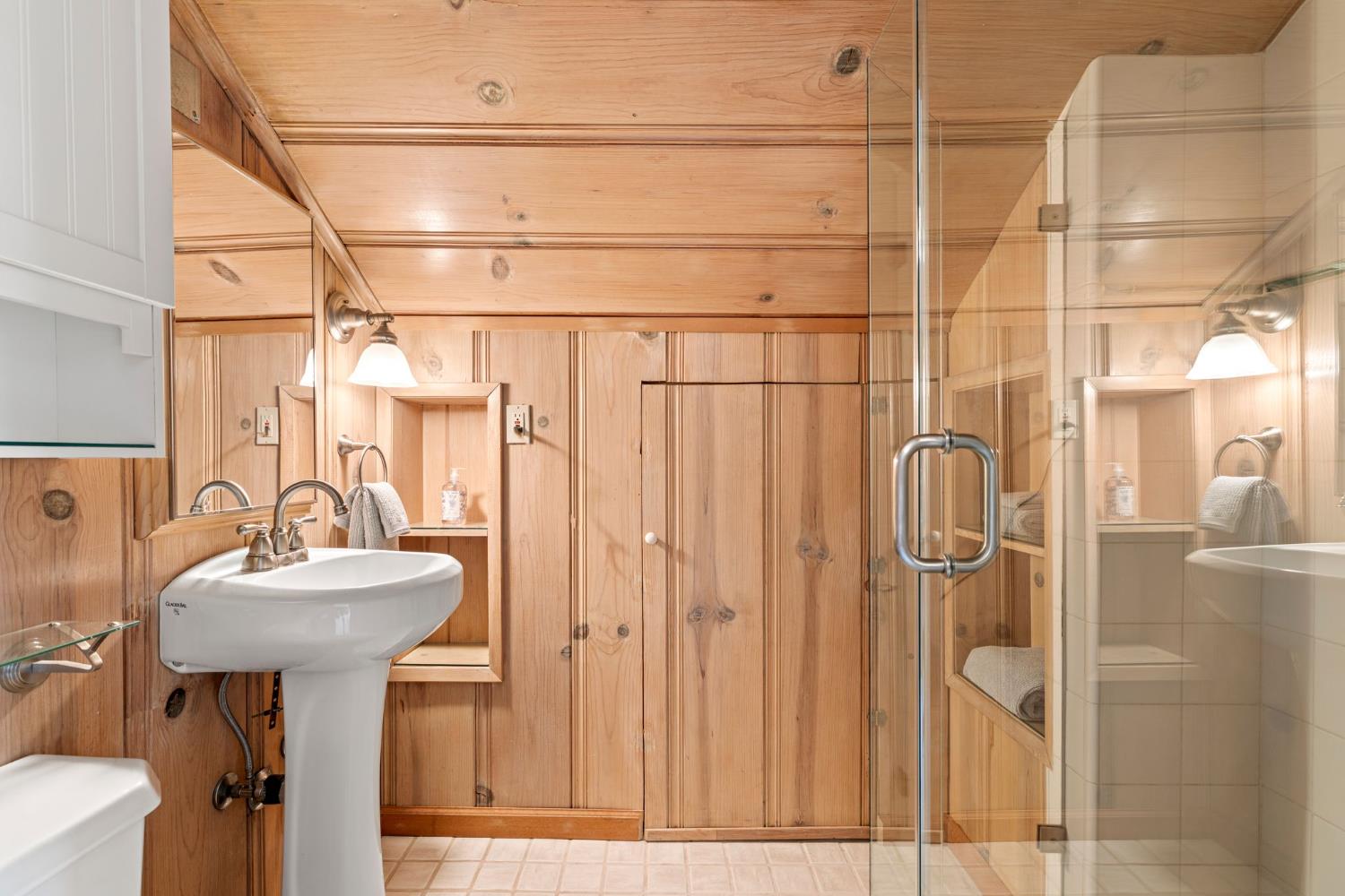 5821 Spanish Flat Road Placerville, CA 95667 - Photo 28 of 97 a bathroom with a sink mirror and shower