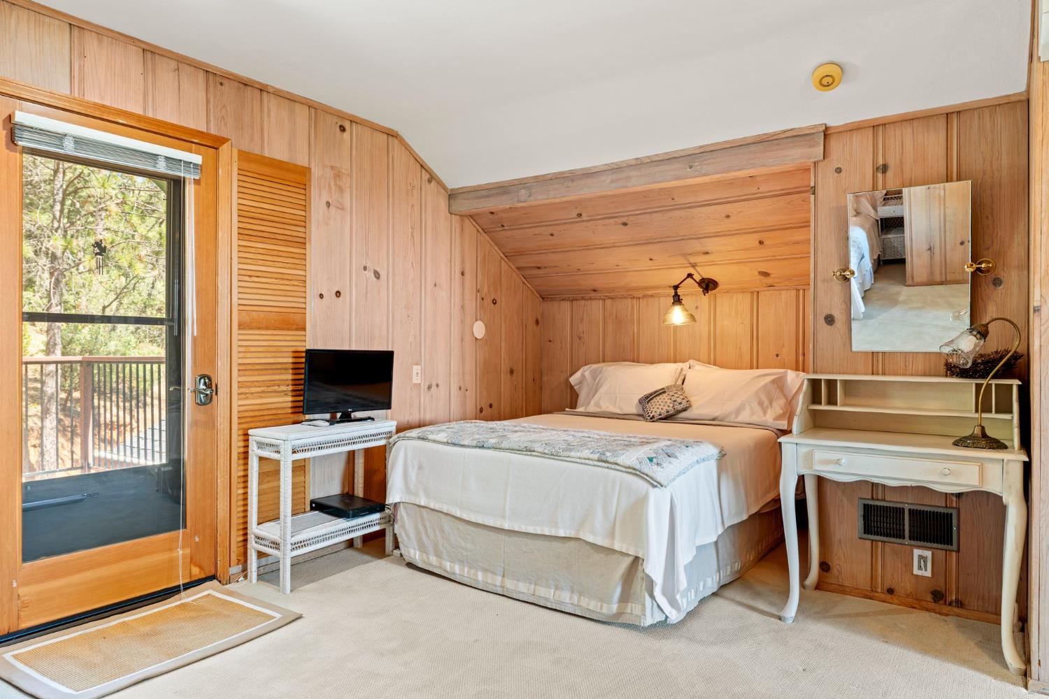 5821 Spanish Flat Road Placerville, CA 95667 - Photo 32 of 97 a bedroom with a bed and a fireplace