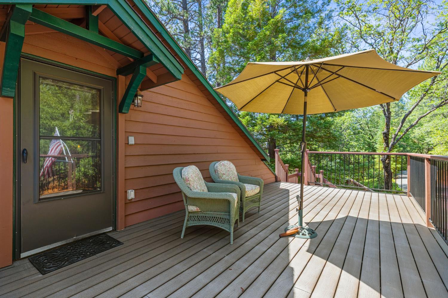 5821 Spanish Flat Road Placerville, CA 95667 - Photo 41 of 97 a view of deck with table and chairs under an umbrella
