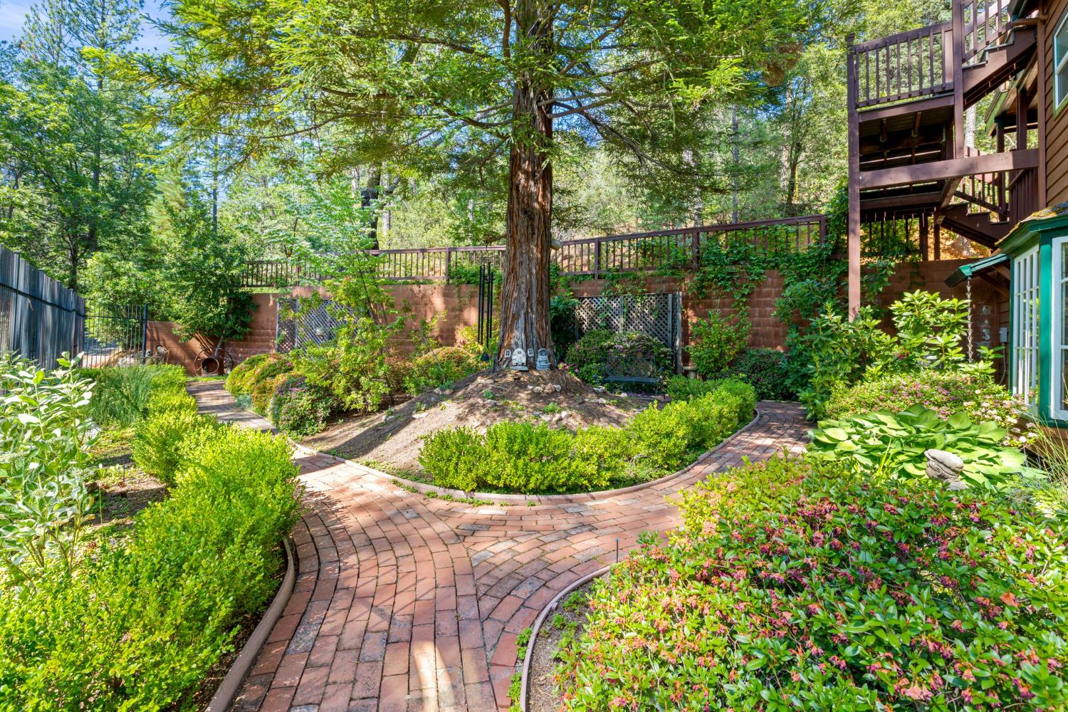 5821 Spanish Flat Road Placerville, CA 95667 - Photo 67 of 97 a view of a garden with a fountain