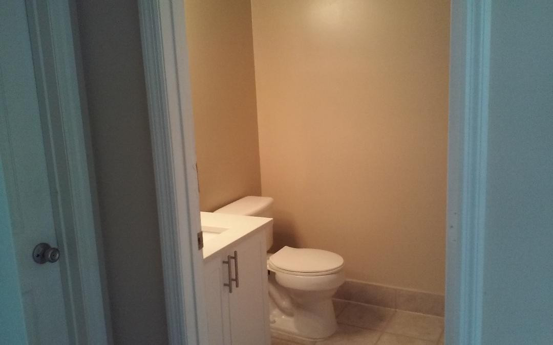 4171 Haverhill Road, Unit 1013 West Palm Beach, FL 33417 - Photo 11 of 14 a white toilet sitting next to a white cabinet