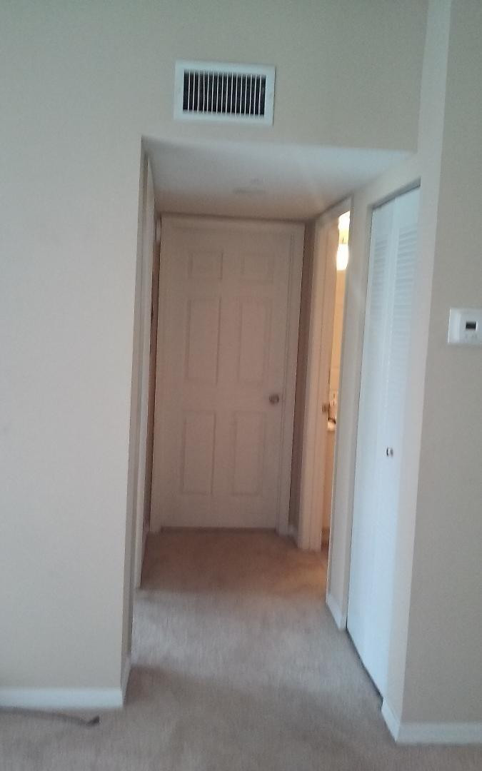 4171 Haverhill Road, Unit 1013 West Palm Beach, FL 33417 - Photo 12 of 14 a view of a room with a hallway