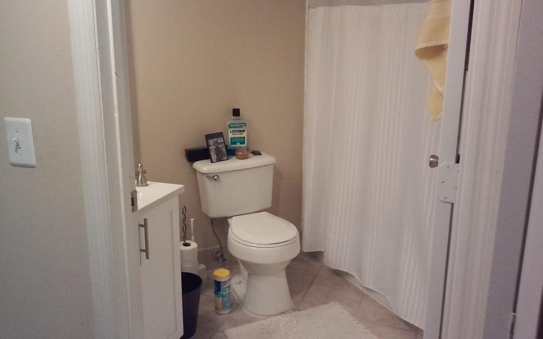 4171 Haverhill Road, Unit 1013 West Palm Beach, FL 33417 - Photo 7 of 14 a white toilet sitting next to a small bathroom
