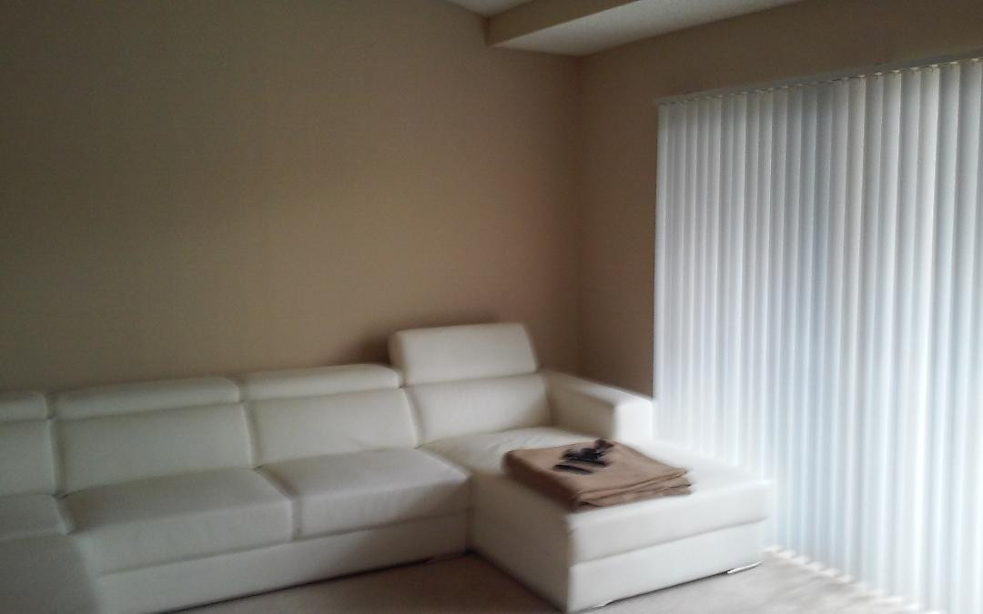 4171 Haverhill Road, Unit 1013 West Palm Beach, FL 33417 - Photo 10 of 14 a living room with furniture and a lamp