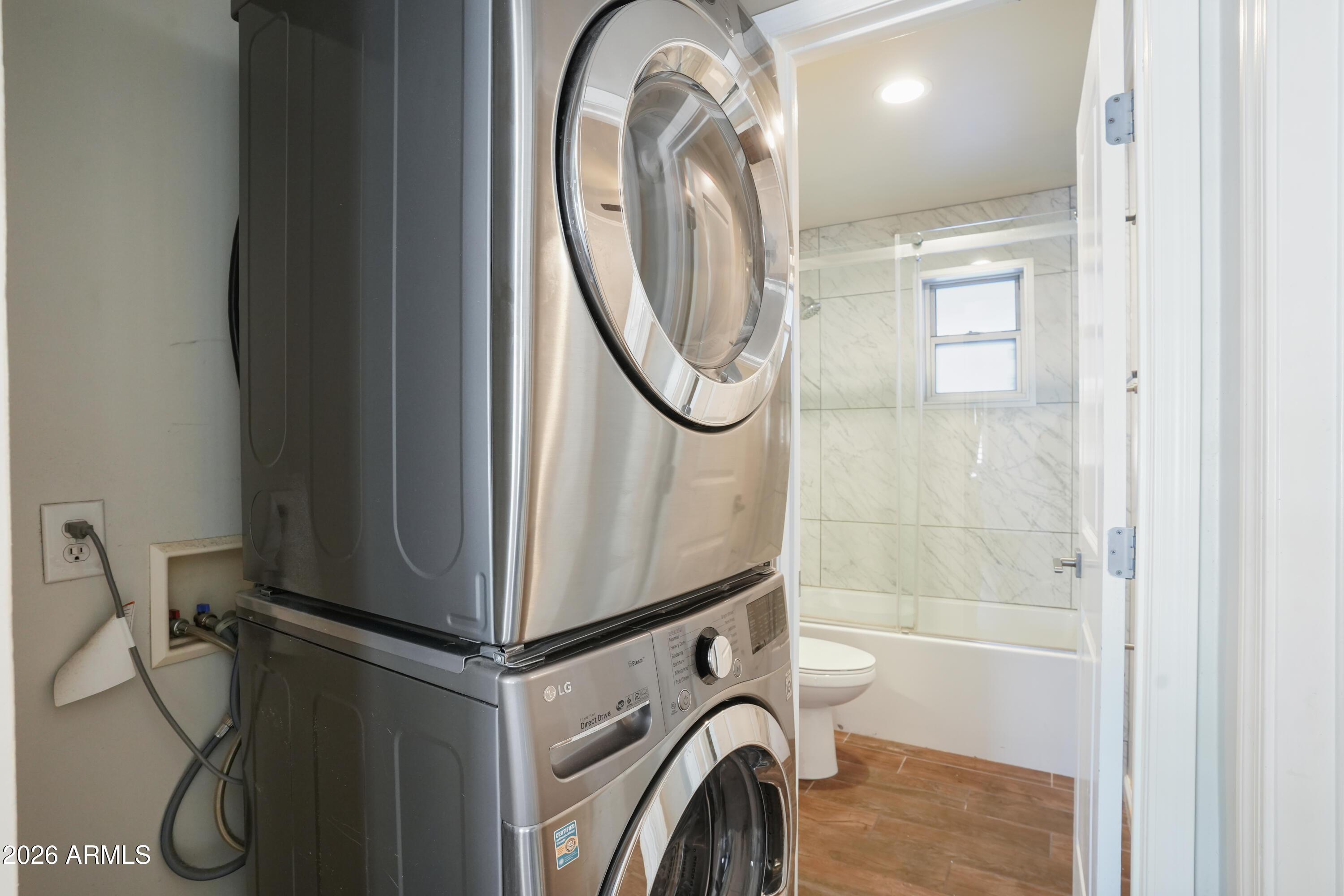 3426 North Miller Road, Unit 5 Scottsdale, AZ 85251 - Photo 6 of 11 a utility room with dryer and washer