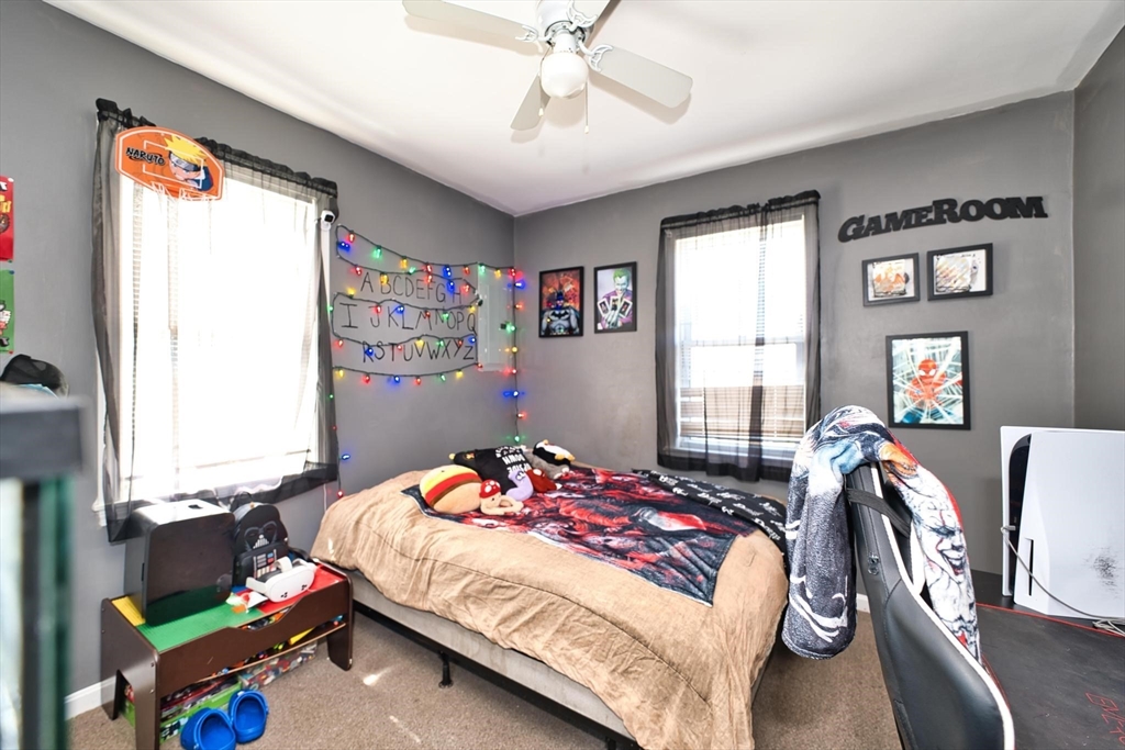 232 Alden Street Fall River, MA 02723 - Photo 23 of 34 a bedroom with a bed and a window