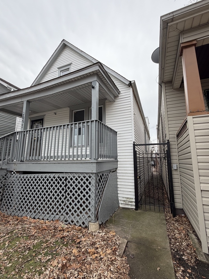 2057 West 70th Place Chicago, IL 60636 - Photo 2 of 8 a view of a black gate