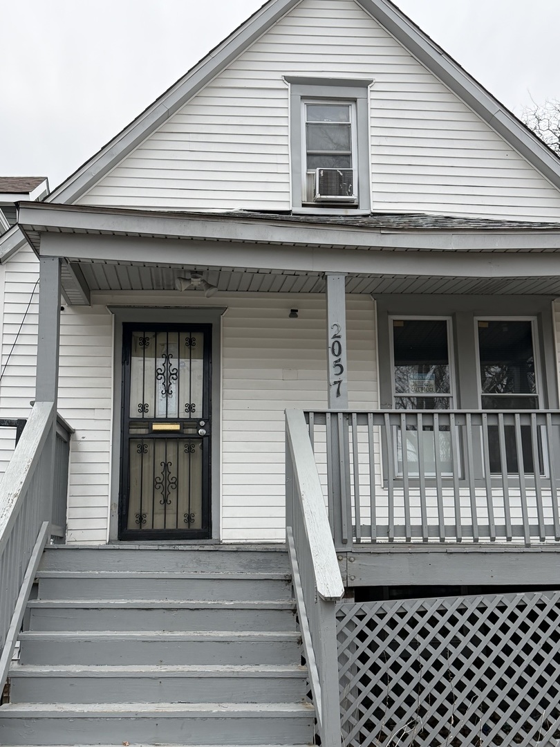 2057 West 70th Place Chicago, IL 60636 - Photo 3 of 8 a front view of a house