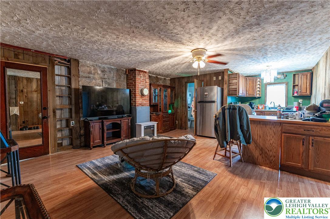 2485 Hieter Road Quakertown, PA 18951 - Photo 69 of 97 Wood flooring and paneling create a warm and inviting atmosphere, perfect for comfortable living.