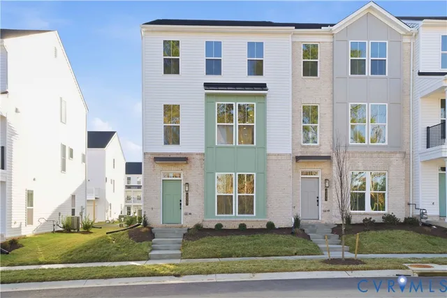 a front view of a building with a yard