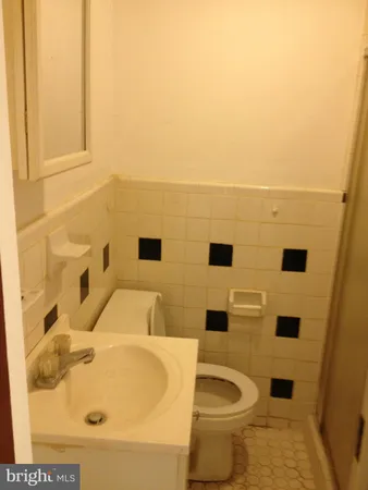 a bathroom with a sink and toilet