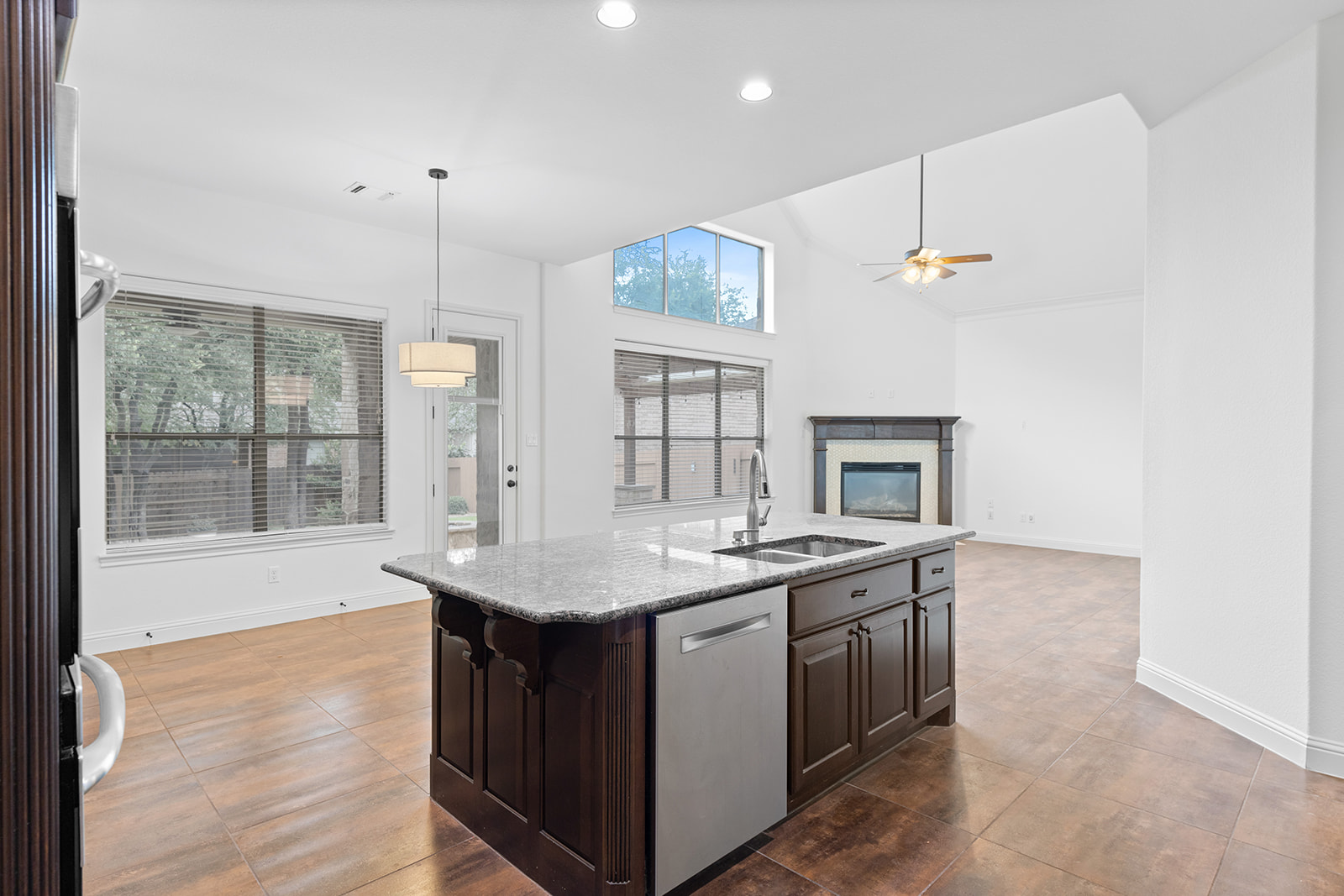 114 North Saddle Ridge Drive Cedar Park, TX 78613 - Photo 13 of 40 a kitchen with a sink stove and wooden floor
