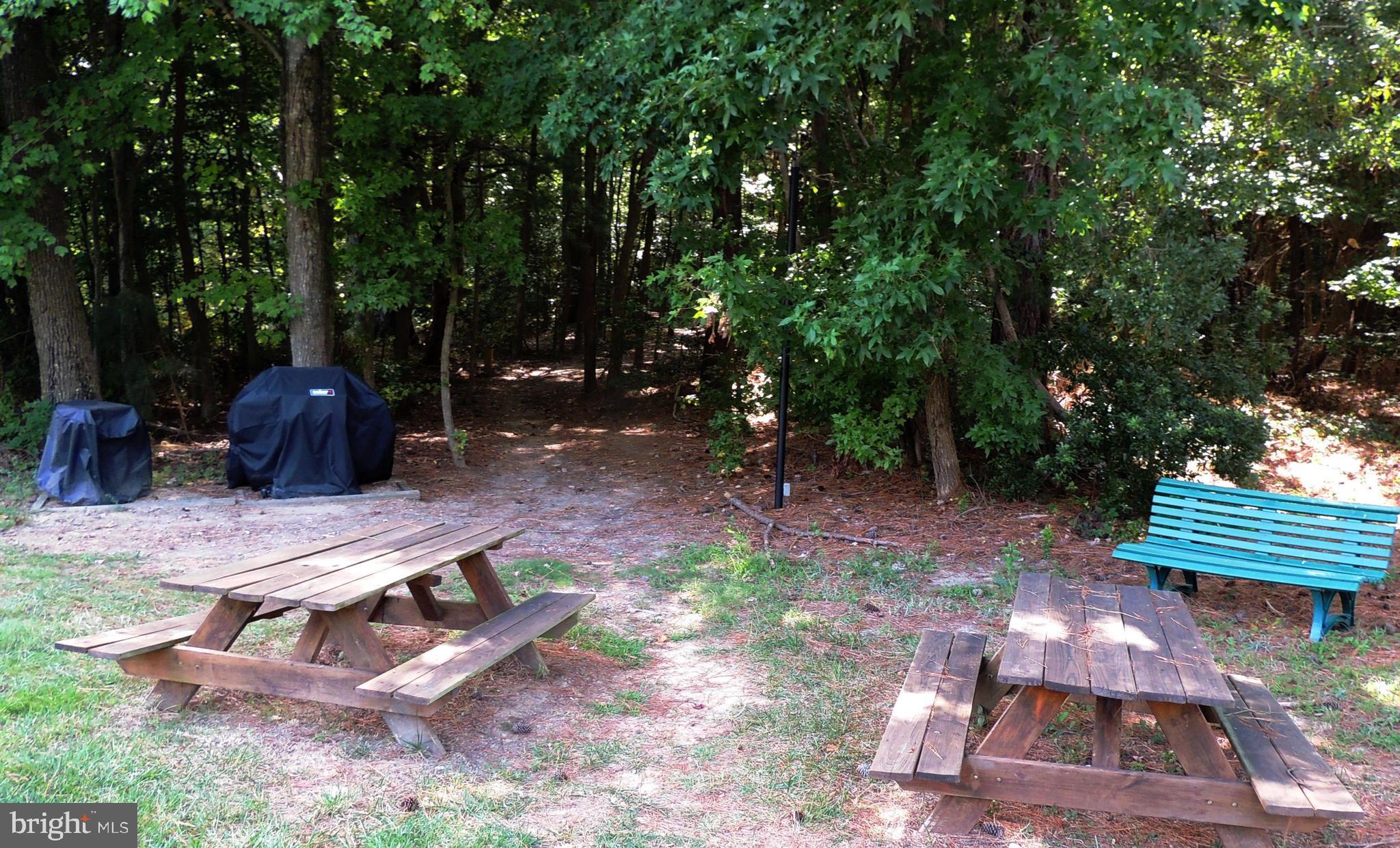 1331 Schooner Loop, Unit 1331 Solomons, MD 20688 - Photo 14 of 53 a view of a backyard with sitting area