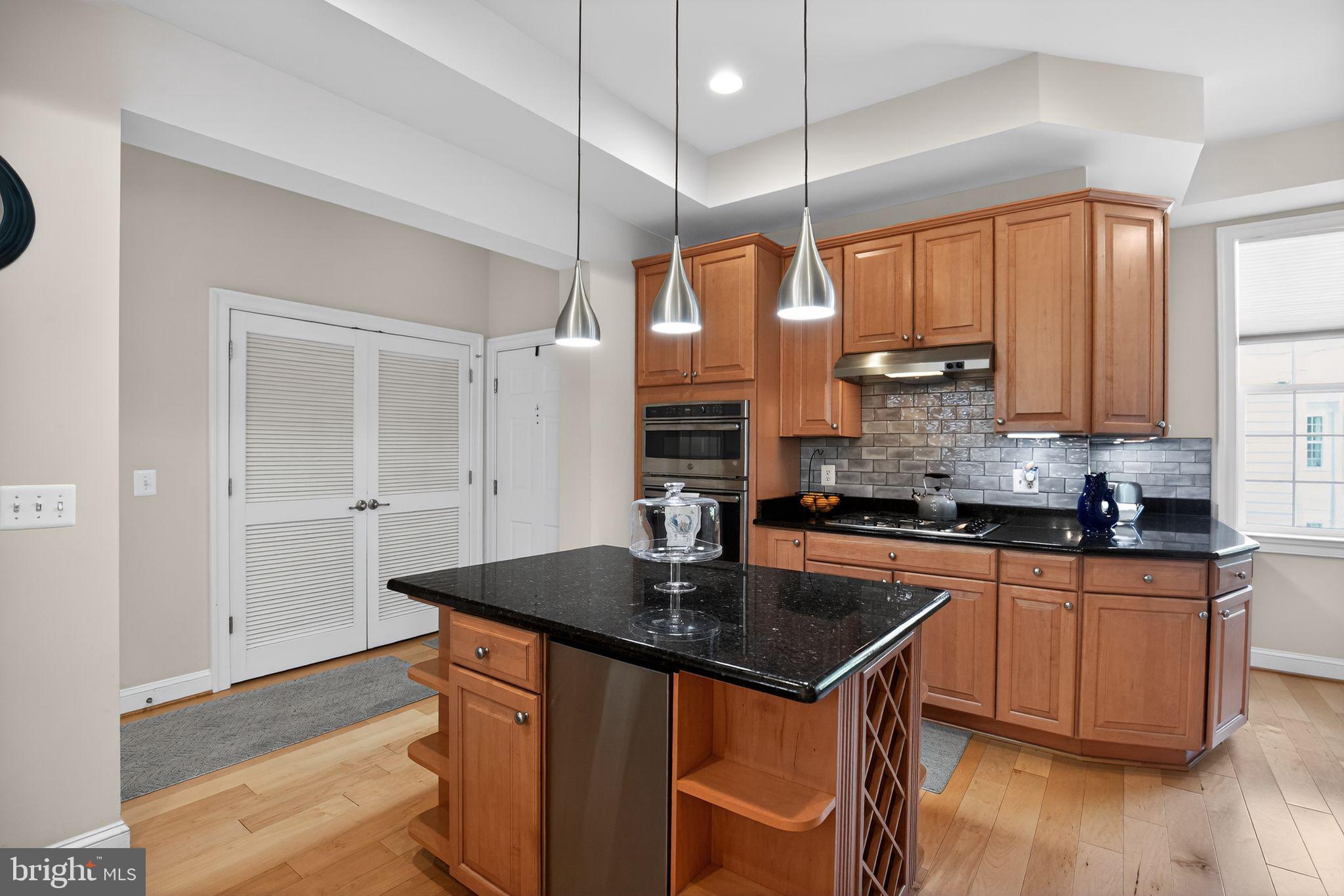 1331 Schooner Loop, Unit 1331 Solomons, MD 20688 - Photo 16 of 53 Kitchen with updated lighting and backsplash