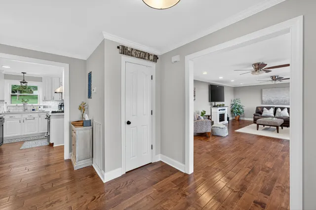 a room with a wooden floor and white walls
