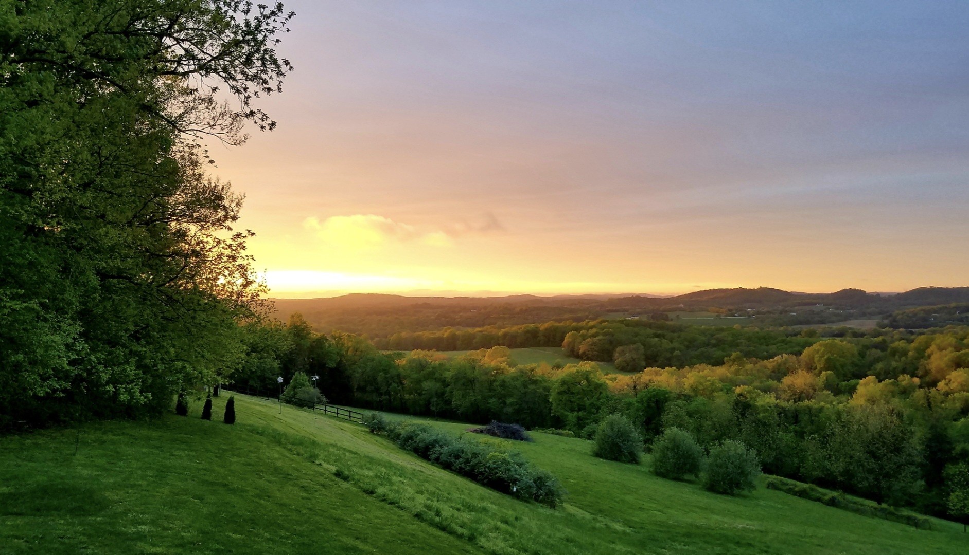 915 Normandy Road Normandy, TN 37360 - Photo 2 of 100 a view of a lush green field with mountains in the background