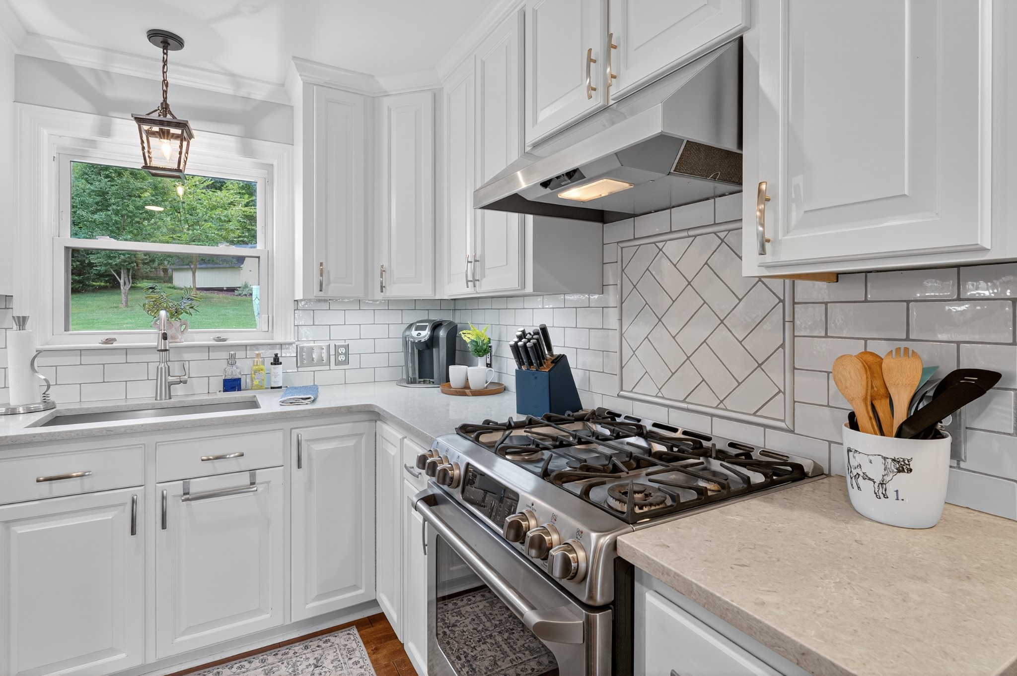 915 Normandy Road Normandy, TN 37360 - Photo 23 of 100 a kitchen with stainless steel appliances granite countertop a sink stove and cabinets