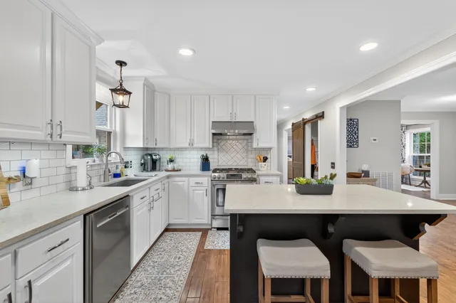 a bedroom with a bed and windows