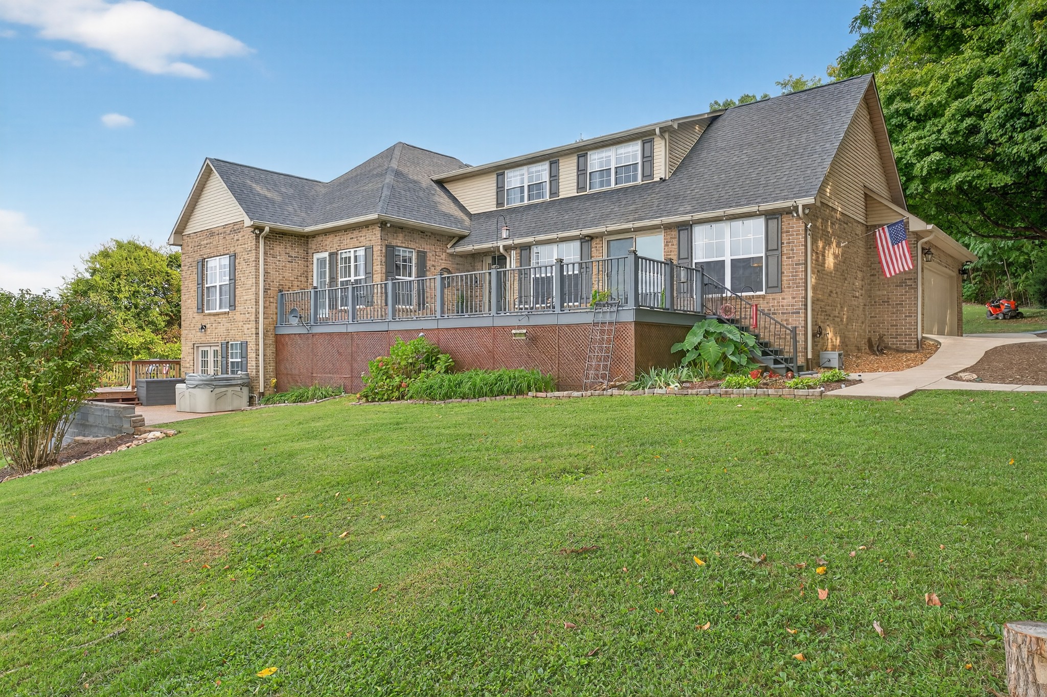 915 Normandy Road Normandy, TN 37360 - Photo 3 of 100 a front view of a house with a garden and plants