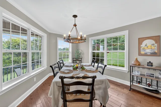 a spacious bathroom with a granite countertop double vanity sink and a mirror