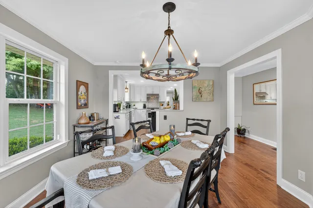 a spacious bathroom with a sink a mirror and a toilet
