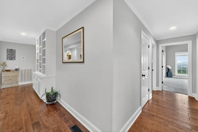 a view of a room that has a large window and a yard