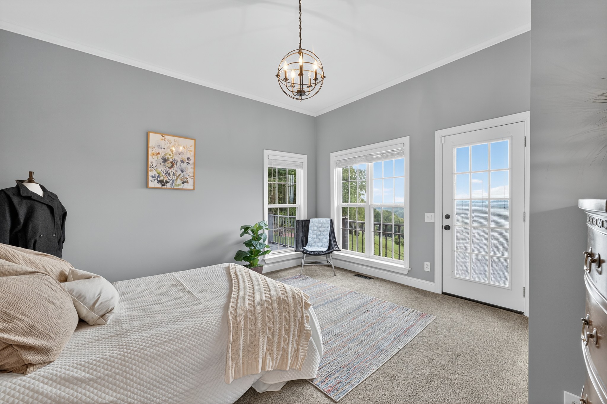 915 Normandy Road Normandy, TN 37360 - Photo 39 of 100 a bedroom with a large bed and a chandelier