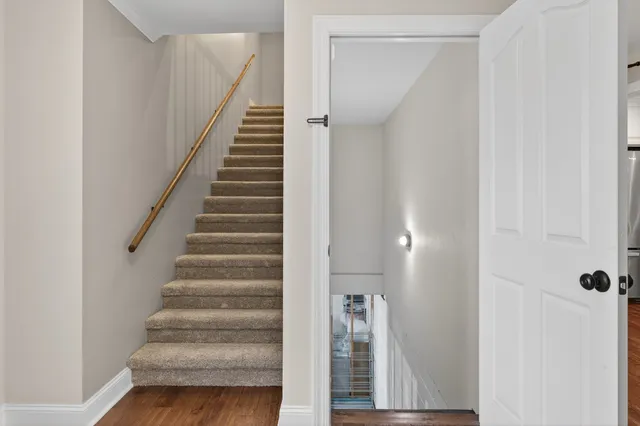 a view of a house with a yard and a garden