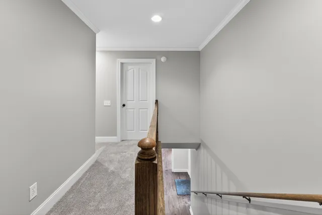 a front view of a house with yard and green space