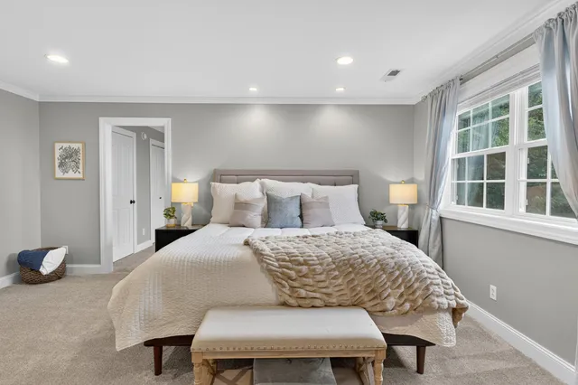 an aerial view of a houses with outdoor space and swimming pool