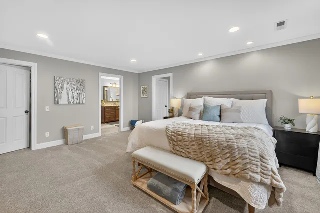 a view of a house with a big yard and sitting area