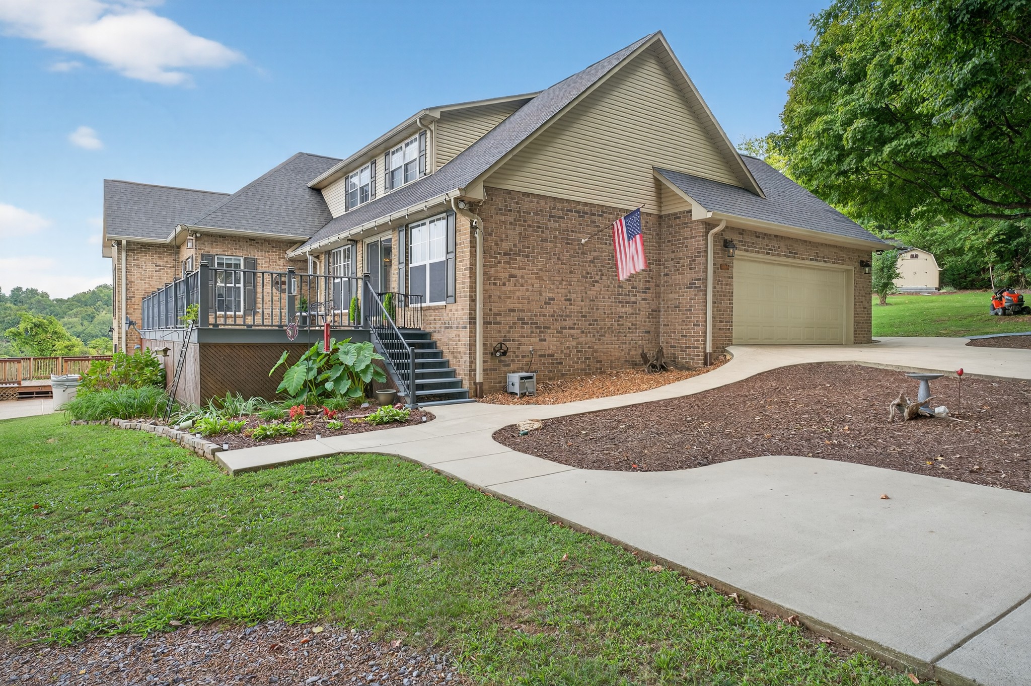 915 Normandy Road Normandy, TN 37360 - Photo 6 of 100 a front view of a house with a yard and garage