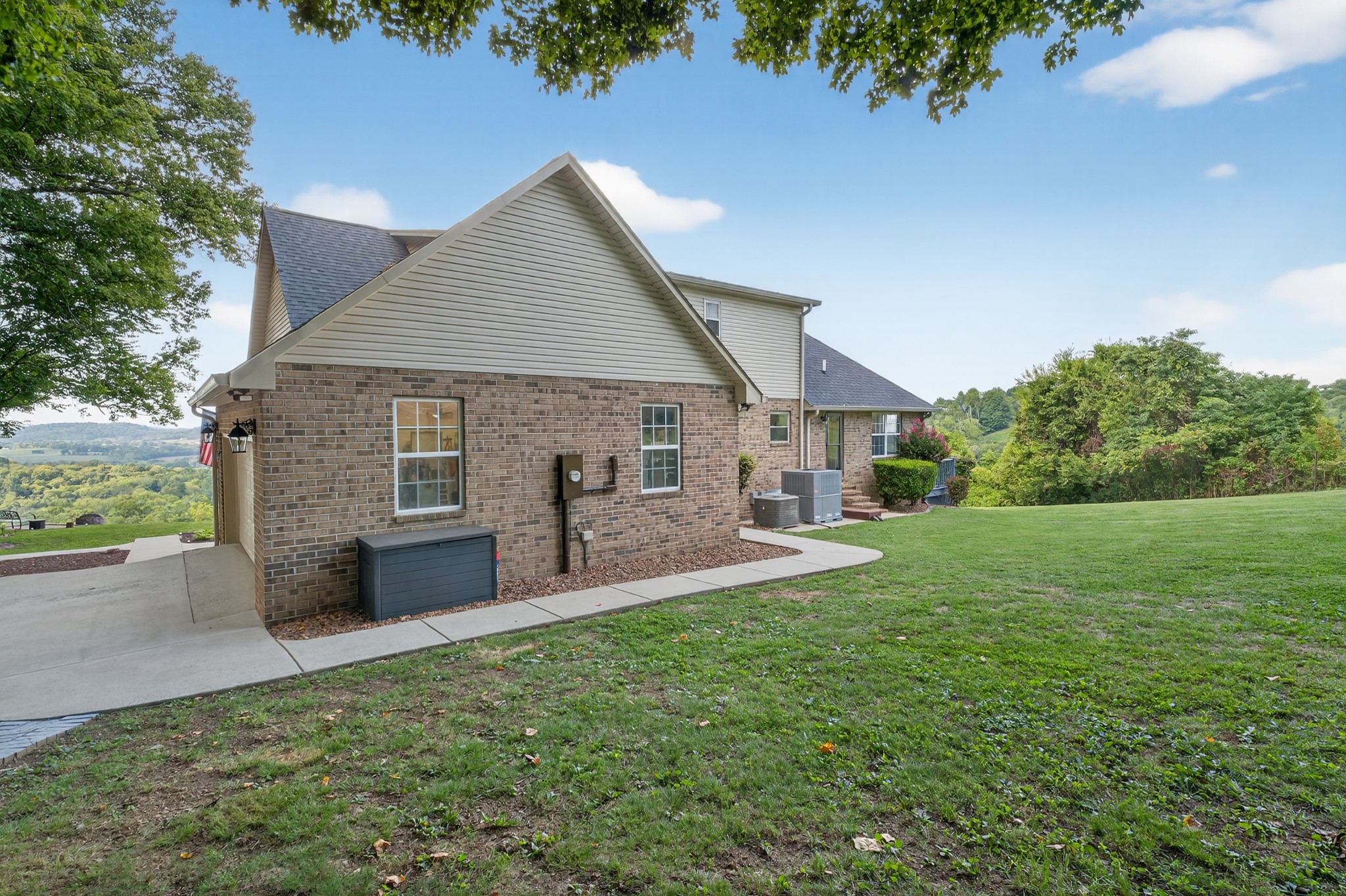 915 Normandy Road Normandy, TN 37360 - Photo 77 of 100 a front view of a house with patio and garden