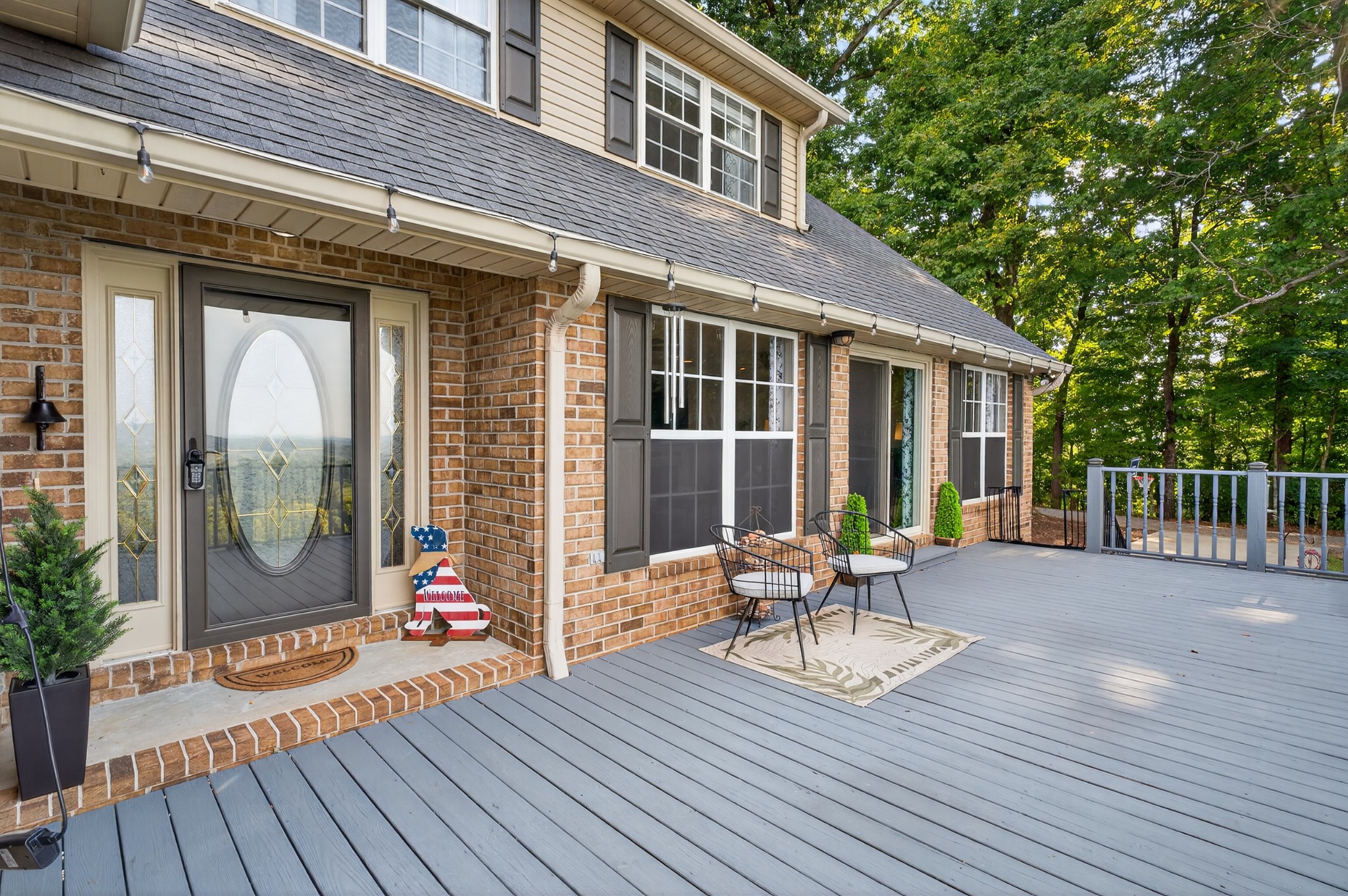 915 Normandy Road Normandy, TN 37360 - Photo 8 of 100 a balcony with wooden floor table and chairs