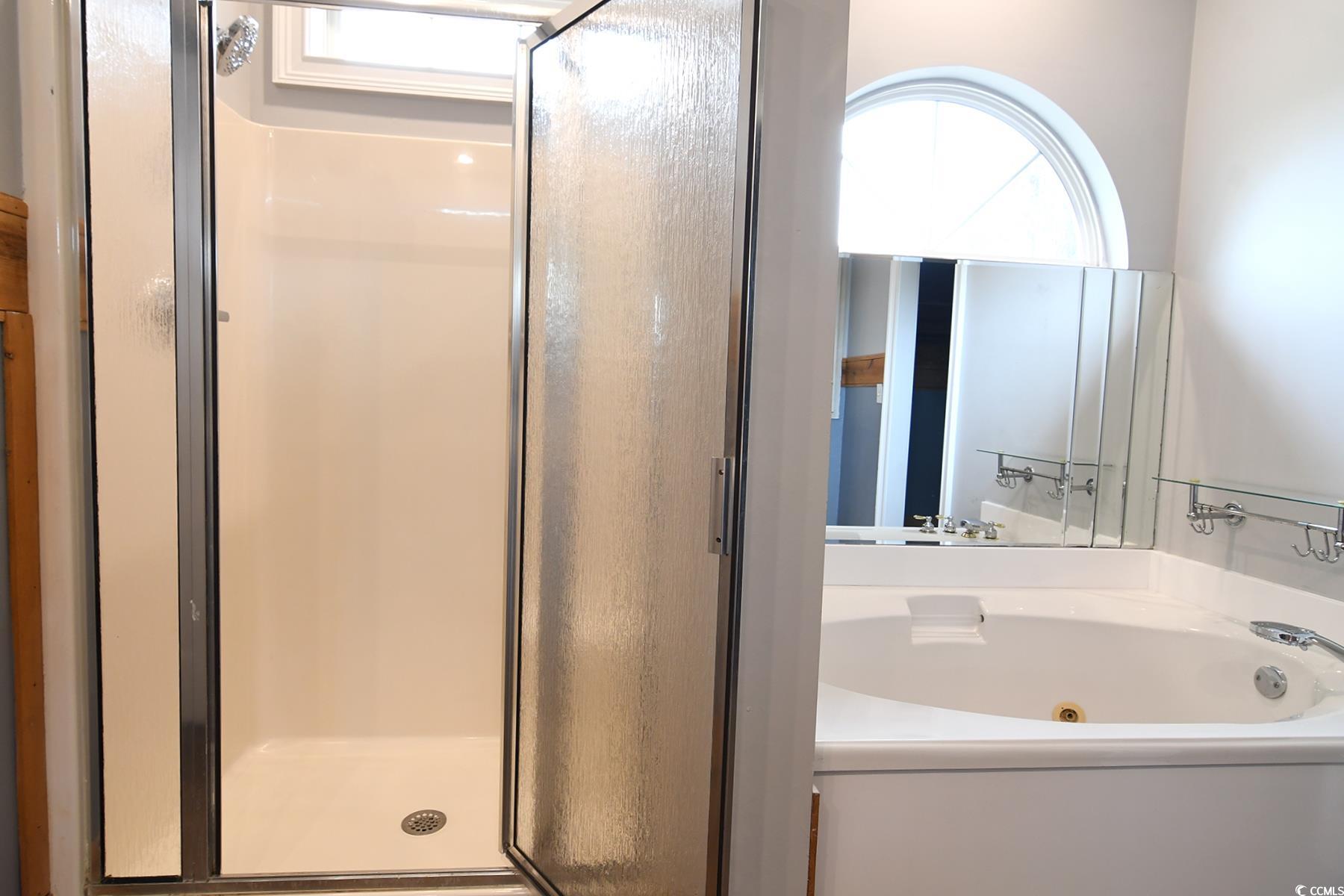 971 Folly Road Myrtle Beach, SC 29588 - Photo 13 of 25 Bathroom featuring a stall shower