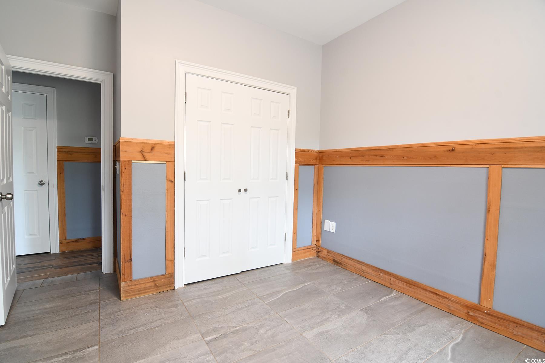 971 Folly Road Myrtle Beach, SC 29588 - Photo 15 of 25 Unfurnished bedroom with a closet