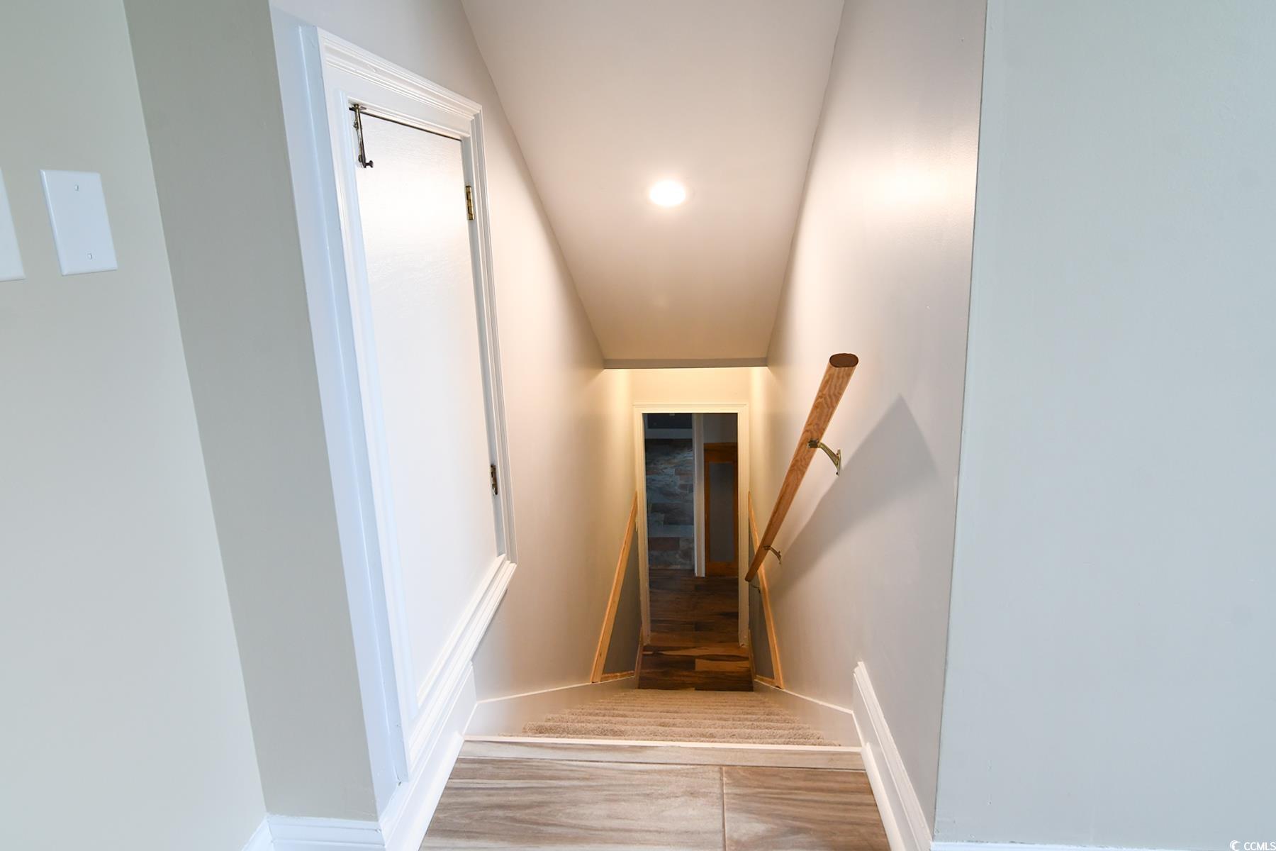 971 Folly Road Myrtle Beach, SC 29588 - Photo 18 of 25 Stairway with baseboards and recessed lighting