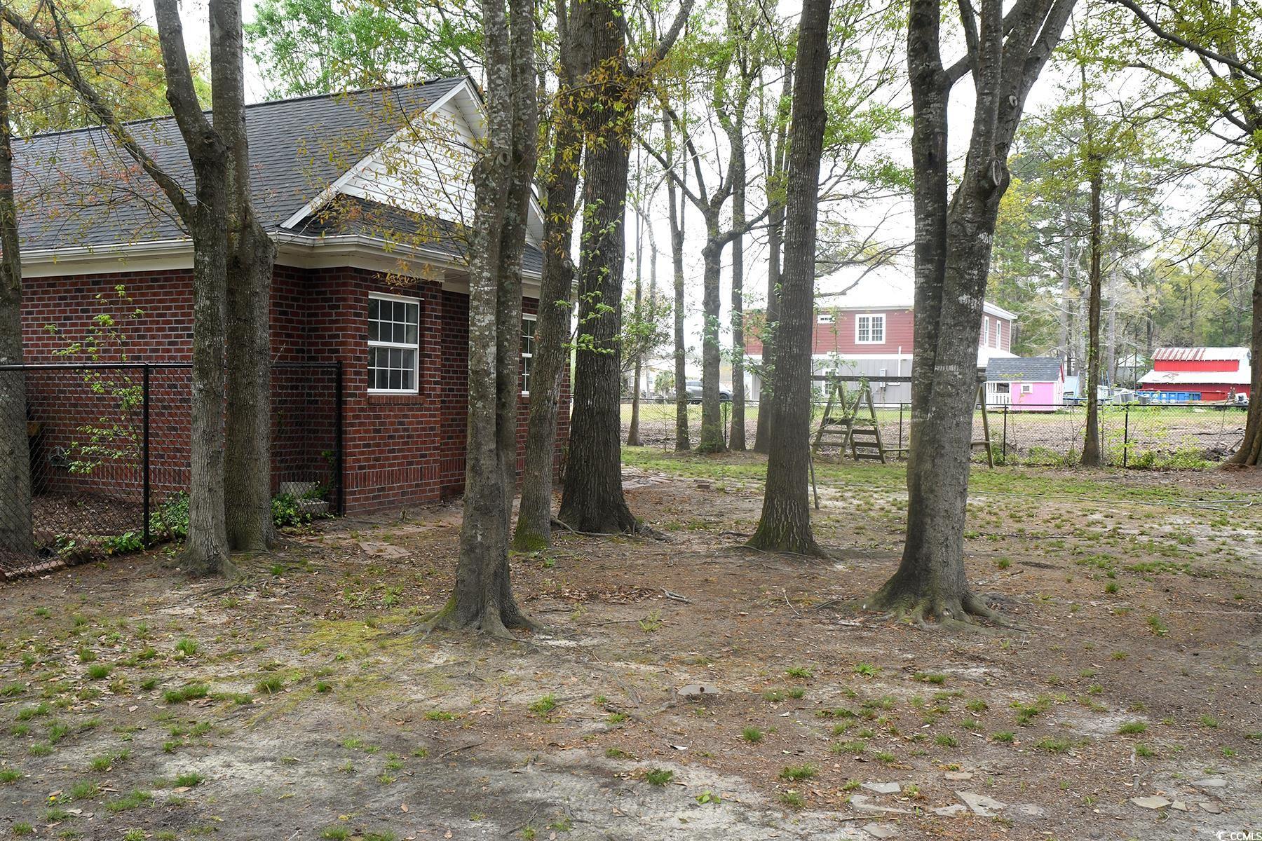 971 Folly Road Myrtle Beach, SC 29588 - Photo 23 of 25 View of yard featuring fence
