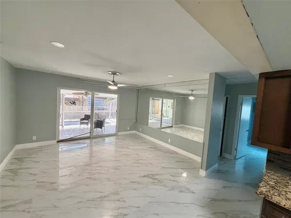 a view of an empty room with glass door