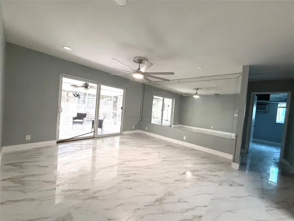 a view of an empty room with a window