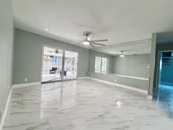 a view of an empty room with a window