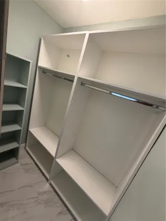 a view of an empty room with empty racks